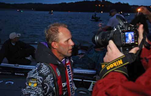 <p>
	Aaron Martens speaks to a reporter as he awaits the start of the third morning.</p>
