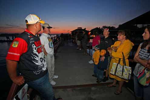<p>
	Jeremy Starks and his family converse on the dock.</p>
