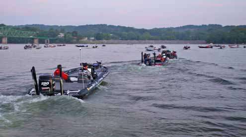 <p>
	Boats idle out to start the last day of the Douglas Lake Challenge.</p>
