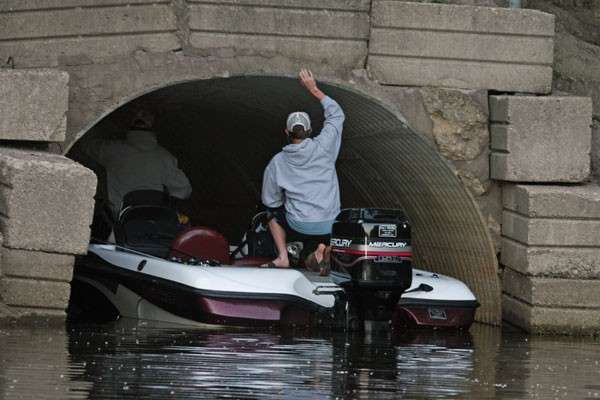 <p>
	Aaron and Kyle Casper disappear beneath a culvert in a backwater off the main river channel.</p>
