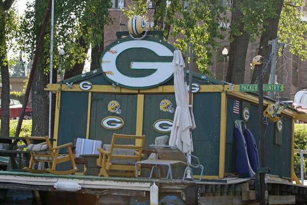 <p>
	A Green Bay Packers fan shows his team spirit with a fish shanty decked on in the teamâs colors, complete with a football helmet. </p>
