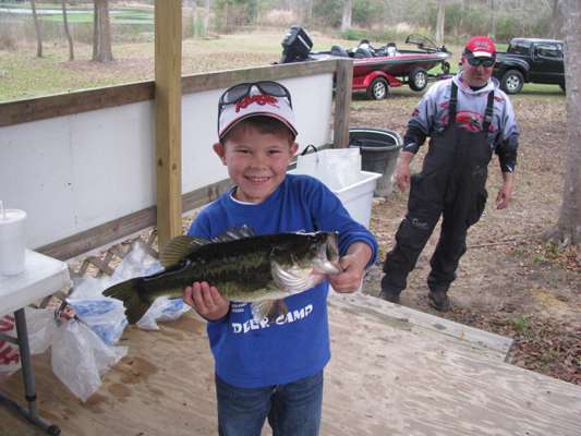 <p>
	Shane Dill, 6, caught the big fish in a tournament. He was accompanied by his dad, Bryan, in the background.</p>
