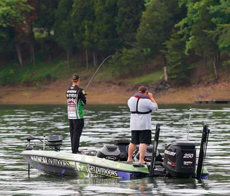 <p>
	Jonathon VanDam hits a creek arm as a Marshal looks on. JVD was in 46th after Day One.</p>
