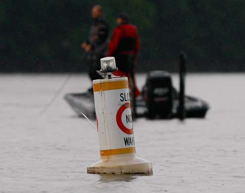 <p>
	Aaron Martens works the main river just outside the no wake marker.</p>
