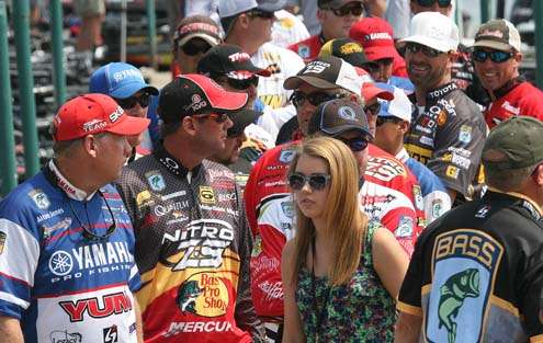 
<p>
	A line of Elite anglers wait to pick up a weigh-in bag Thursday.</p>
