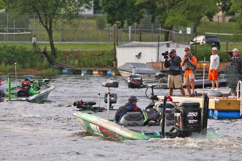 <p>
	Shaw Grigsby follows the line of boats and smiles for the camera.</p>
