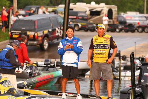 <p>
	Terry Scroggins and Takahiro Omori stand side by side on the dock and exchange friendly banter.</p>
