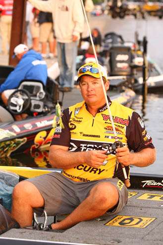 <p>Terry âBig Showâ Scroggins in 12th with 28-11 gears up a topwater frog on one of his many rods.</p>
