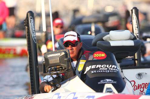 <p>
	Scott Rook idles beside the boat check dock and makes his way toward open water.</p>

