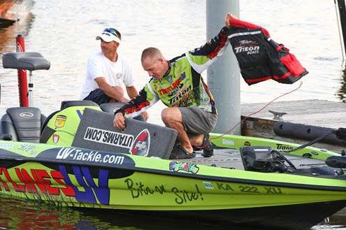 <p>
	Elite Series pro Brent Chapman suits up with a lifejacket before firing up the big engine on Day Two of the Green Bay Challenge.</p>
