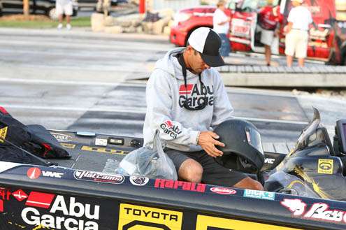 <p>
	Mike Iaconelli pulls out a driving helmet just in case the wind picks up and gets rough on Lake Michigan.</p>
