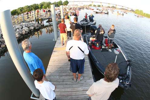 <p>
	The national anthem plays while anglers and spectators show respect.</p>
