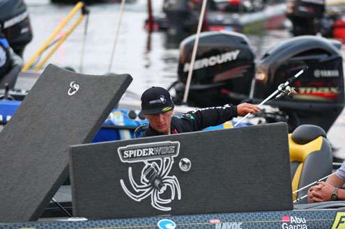 <p> 	Elite Series rookie Fletcher Shryock pulls out his rods and gets ready for Day One.</p> 