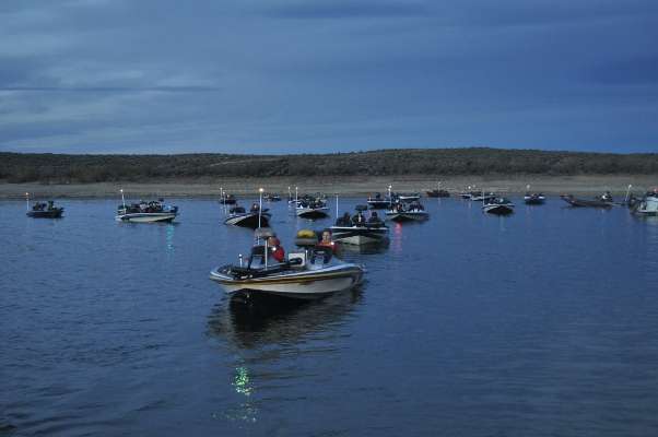 <p>
	A parade of boats waits in the wings. The anglers are undoubtedly enjoying the warming weather, which was in the high 50s this morning, a solid 10 to 15 degrees warmer than the previous two launches.</p>
