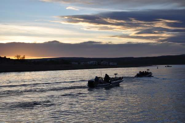 <p>
	The sun peeks over the mountains as the last Junior Bassmaster team takes off.</p>
