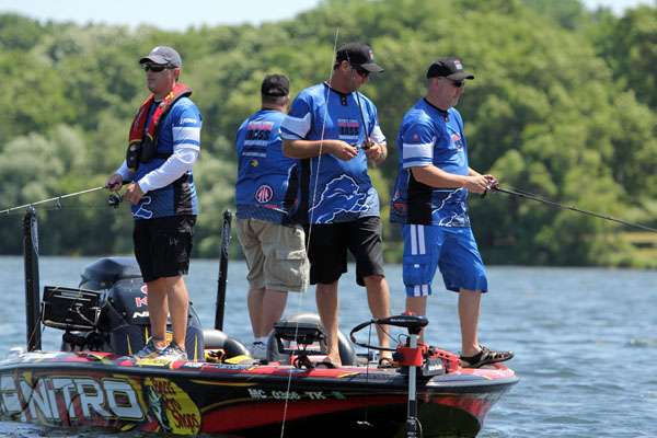 KVD talks fishing with his teammates including Lions Head Coach Jim Schwartz at left.