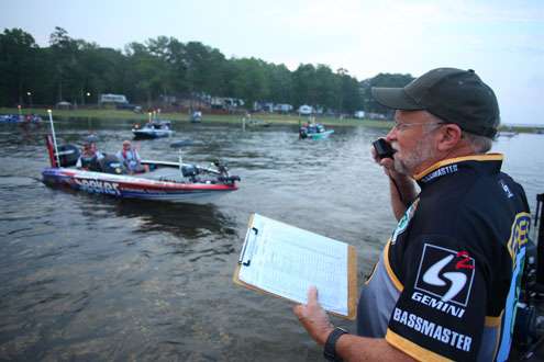 <p>
	Chuck Harbin calls out boat numbers as anglers idle through for take-off.</p>
