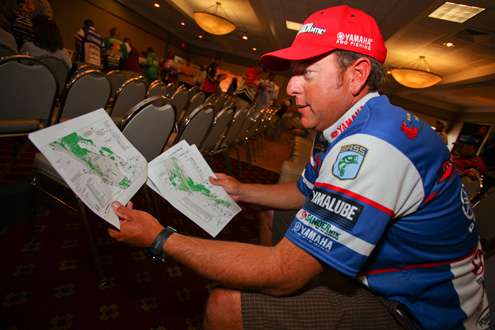 <p>
	Dean Rojas checks out maps of the Mississippi River, and the maze of water available to fish.</p>
