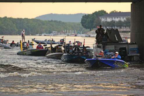 <p>
	A parade of boats passes the release boat for inspection as Day Three gets underway.</p>
