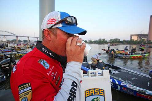 <p>
	Kelly Jordon drinks his usual cup of coffee on the dock.</p>
