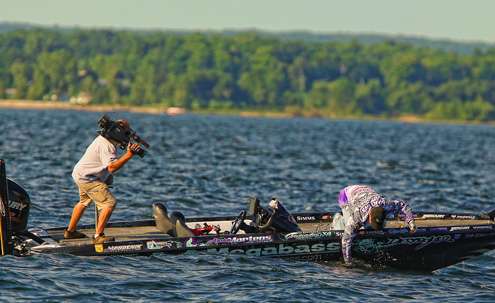 <p>
	Martens reaches deep to get a grip on the fish.</p>
