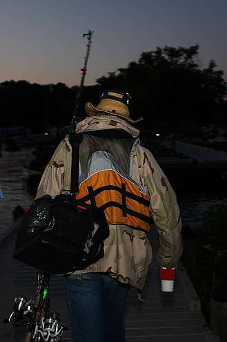 <p>
	Co-angler Jonn Schulz heads down the dock looking for his Day Two pro.</p>
