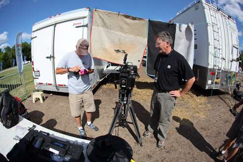 <p>
	B.A.S.S. television host Tommy Sanders (right) and the camera crew prep for some interviews.</p>
