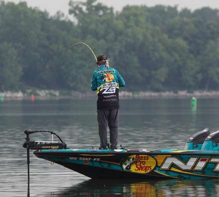 <p>
	Rick Clunn, fishing just downstream from Biffle, gets hooked up.</p>
