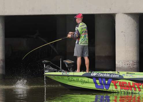 <p>
	Toyota Tundra Bassmaster Angler of the Year leader Brent Chapman hooks up near the dam on Day One.</p>
