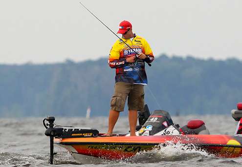 <p>
	Keith Combs rides out the waves as he fishes in the middle of the lake.</p>
