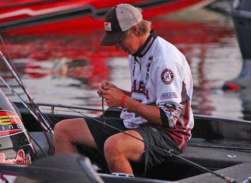 <p>
	A University of Alabama angler works on his tackle.</p>
