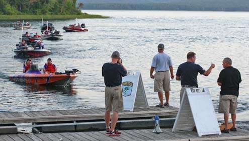 <p>
	The last of the boats head past the dock for the start of Day Two in the Bassmaster Carhartt College Series National Championship.</p>
