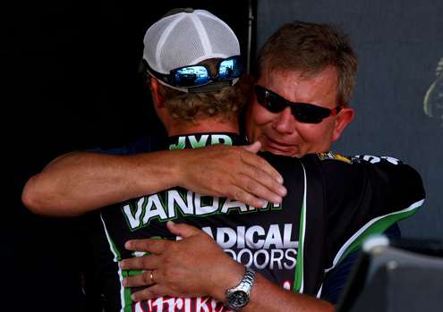 Jonathon VanDam receives a congratulatory hug from his father, Randy VanDam.