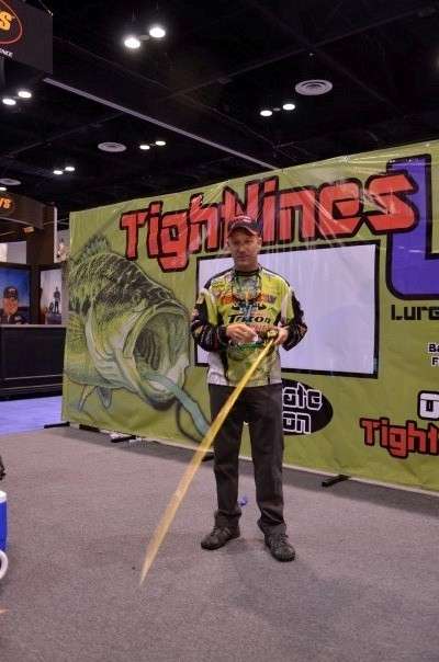 <p>
Brent Chapman practices his pitching inside the Tightlines UV booth.</span></p>
