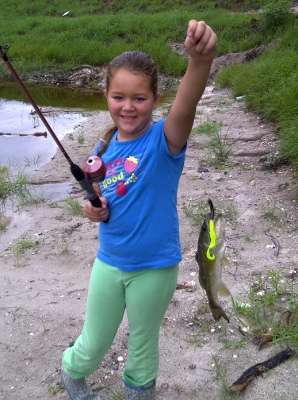 <p>
	Chris Little is proud of his daughter Caleigh, 7, and her bass fishing skills.</p>
