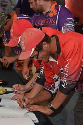 <p>
	Anglers fill out registration forms.</p>
