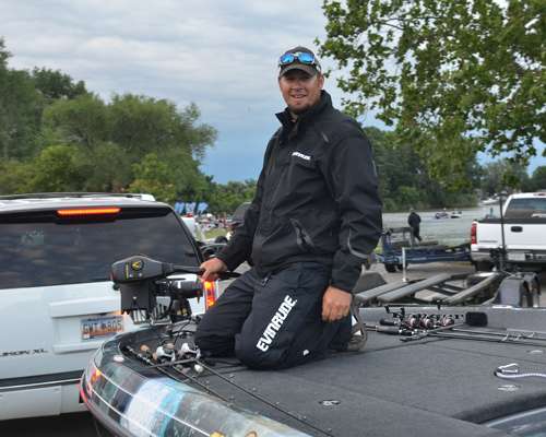 <p>
	Michael Murphy examines his new trolling motor. His was damaged yesterday and needed repair.</p>
