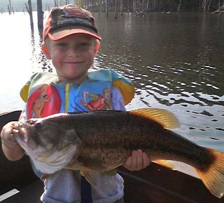 <p>
	This bass was almost as big as the angler who caught it! Gage, 6, caught this 6.7-pounder from Okhissa Lake in Mississippi.</p>
