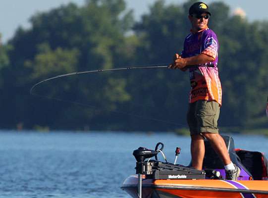 Clemsonâs William Shipes sweeps his rod to bury the hooks into a fish.
