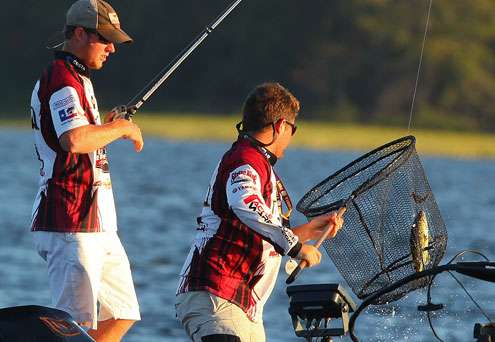 With the bass securely in the net, the ULM team boats their first bass of the day. 
