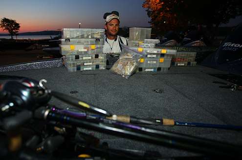 <p>
	Jordan Lee from Auburn University looks over his spread of rods and tackle.</p>
