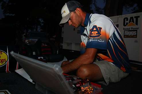 <p>
	Matt Lee from Auburn University inspects his tackle before the start of competition.</p>
