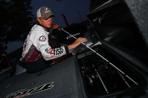 <p>
	Dustin Connell from University of Alabama carefully stows his rods.</p>
