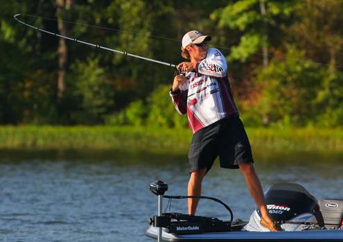 <p>
	Dustin Connell sweeps his rod into a fish.</p>
