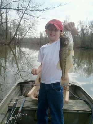 <p>
	Tyler, 9, shows off a nice-size bass while his mom snaps a photo.</p>
