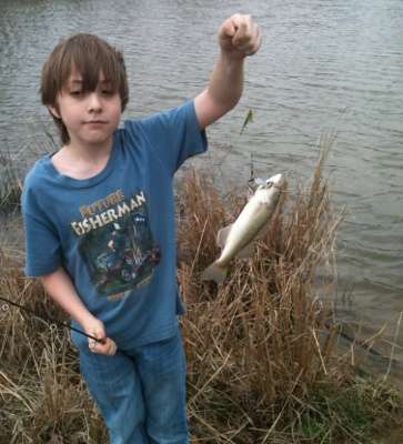 <p>
	Kaleb catches a lively bass!</p>
