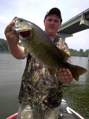 <p>
	Matthew Cross shows off one of multiple big bass heâs caught.</p>
