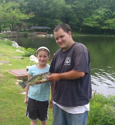 <p>
	Sammy, 12, is learning from a family friend how to fish for bass. Here, theyâre fishing at Fellsmere Pond in Malden, Mass.</p>
