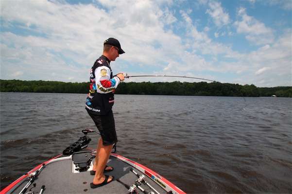 <p>
	<strong>12:25 p.m. </strong>While retrieving a big crankbait parallel to the edge of a main lake point, Roy hangs a lunker bass.</p>
