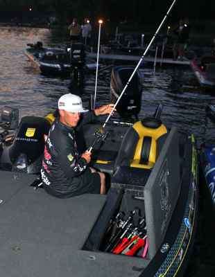 <p>
	Fletcher Shryock prepares his tackle as he readies for one last day on Oneida Lake. He entered the day tied for seventh place with Ott DeFoe â both have 43-7.</p>
